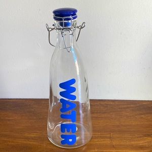 NWOT. Vintage Glass Water/Refrigerator bottle with clamp closure.